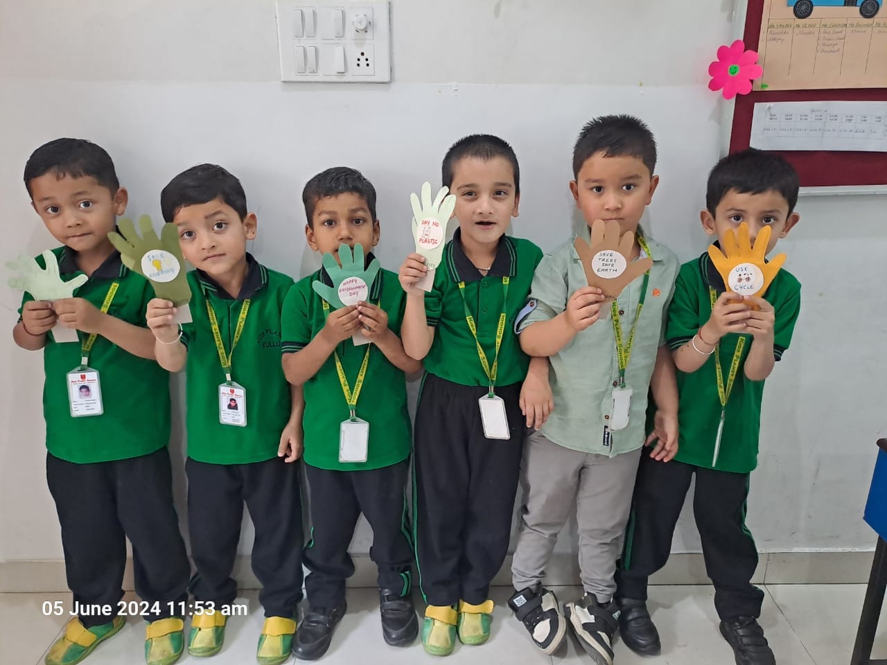 Students displaying handmade craft medals