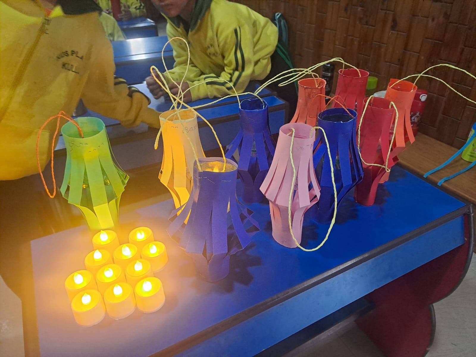 Beautiful handmade paper lanterns in vibrant colors — student craft display