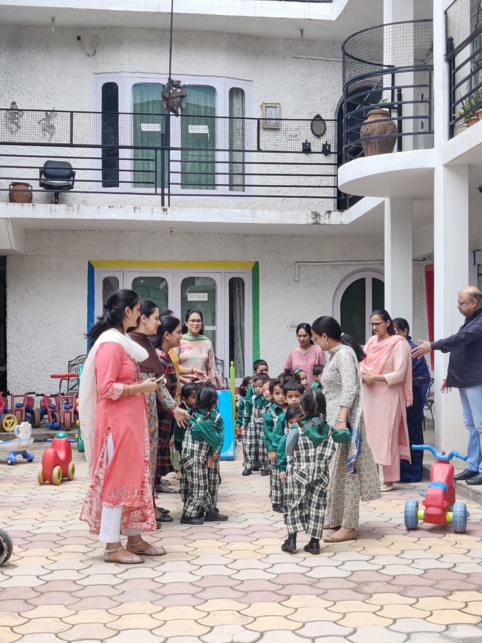 Teachers and students during outdoor activities in the courtyard
