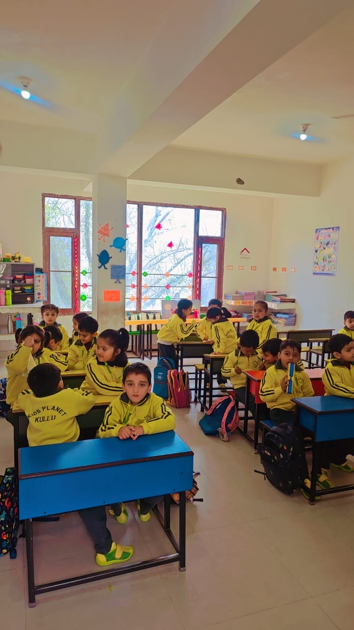 Students in yellow uniforms learning in a bright, modern classroom