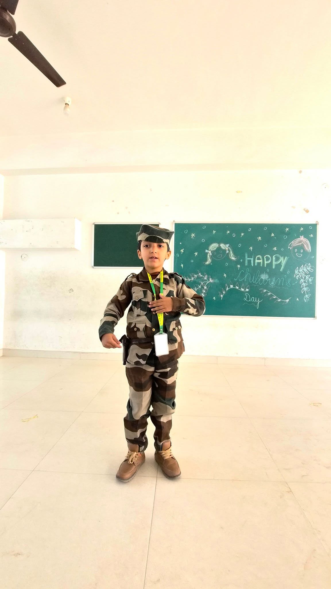 Patriotic fancy dress — student in military costume for Republic Day