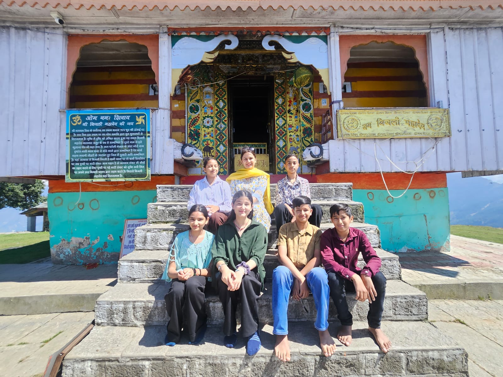 Class 8 students and teachers at temple steps during educational excursion