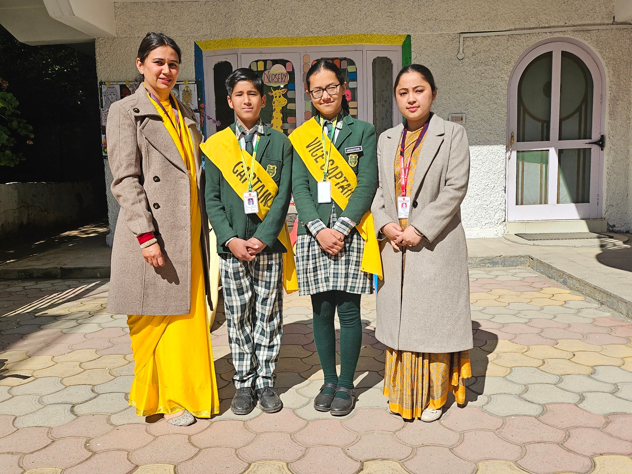 School Captain and Vice Captain with teachers