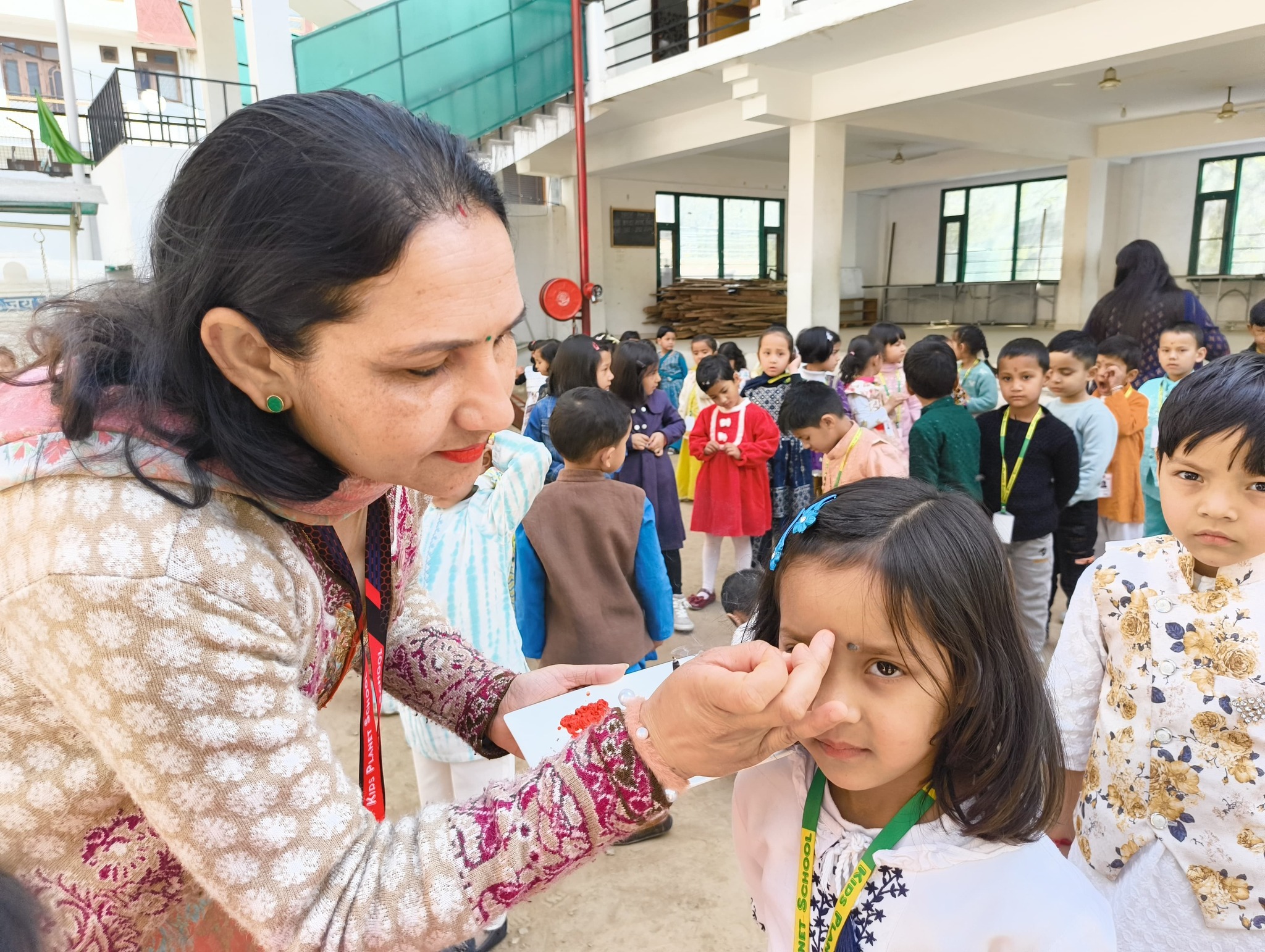 Traditional welcome — applying tilak to students